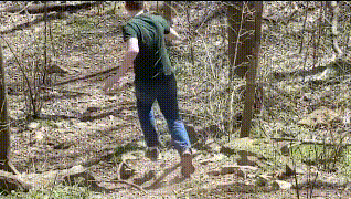Boy falling down hill at park